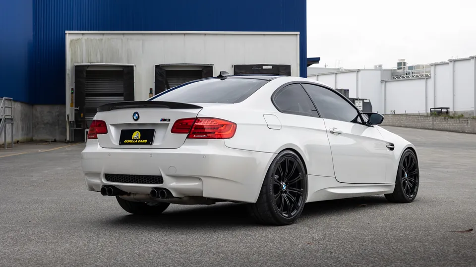 Rear three-quarter view of a white BMW M3