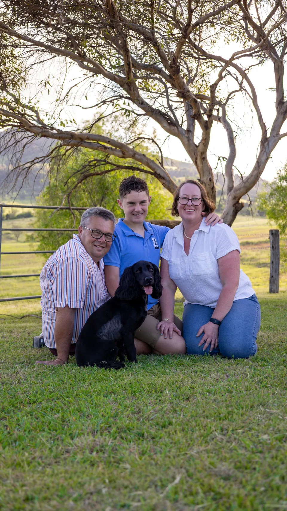 Family group portrait photographed under gum trees